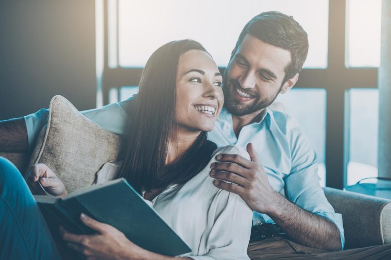Couple lovingly reading together