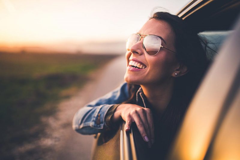 woman-car-deep-breath-happy-joy