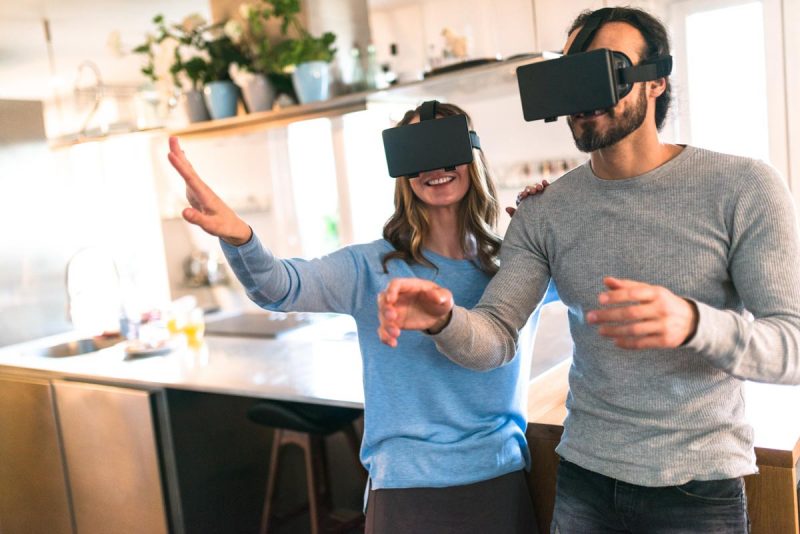 couple using the VR simulator at home