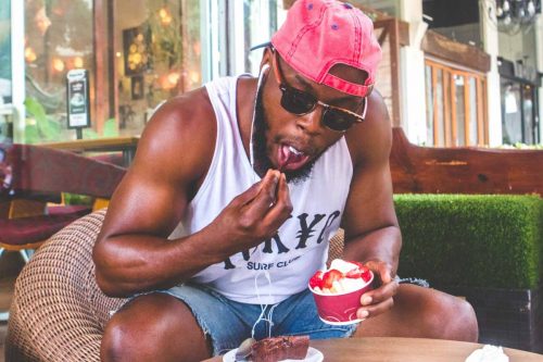 man eating froyo as self care therapy