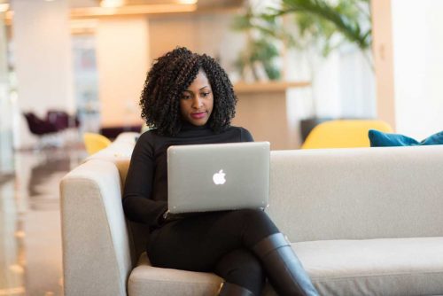 A woman doing online teletherapy